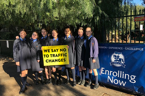 St Joan of Arc Catholic Primary School Haberfield students holding sign against traffic changes in area